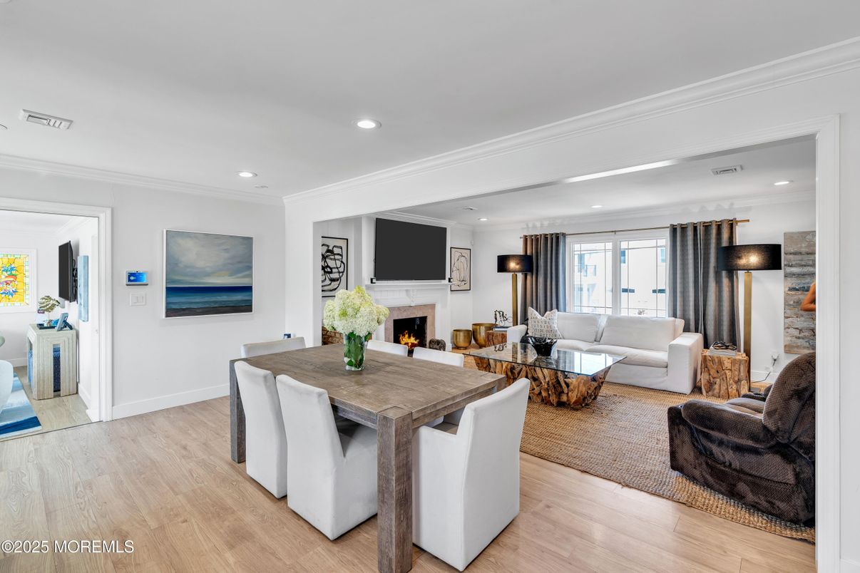 Dining room, Fireplace, Interior, Living room, Recessed Lighting, Wood Texture Flooring