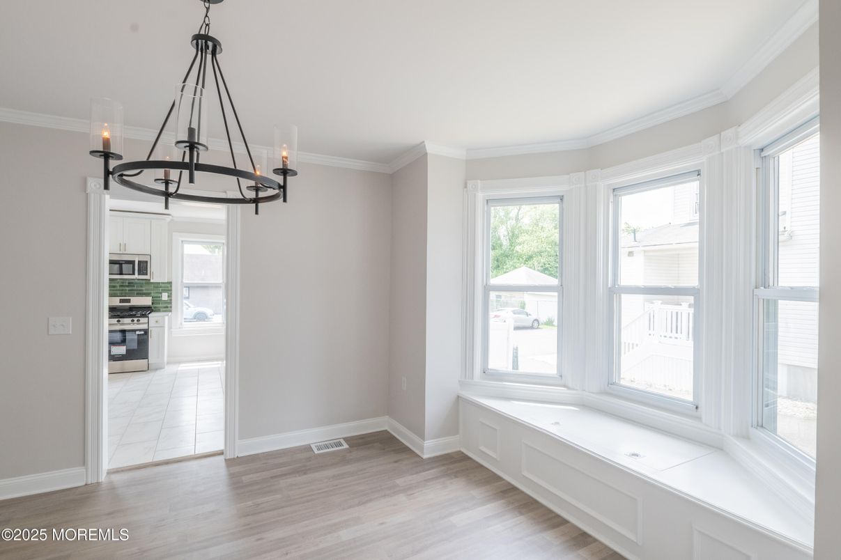 Chandelier, Empty room, Interior, Kitchen, Pendant Lights, Stainless Steel Appliances, Wood Texture Flooring