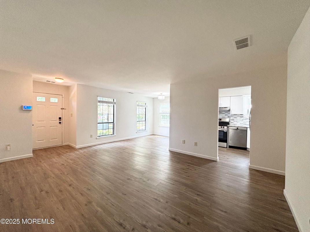 Empty room, Interior, Kitchen, Stainless Steel Appliances, Wood Texture Flooring