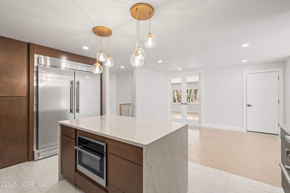 Interior, Kitchen, Marble, Pendant Lights, Recessed Lighting, Stainless Steel Appliances, Wood Texture Flooring