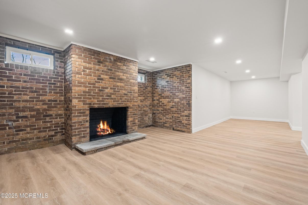 Empty room, Fireplace, Interior, Recessed Lighting, Stone Walls, Wood Texture Flooring