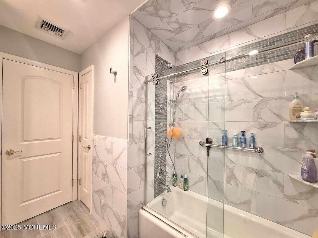 Bathroom, Glass Shower, Interior, Marble Walls, Recessed Lighting, Wood Texture Flooring