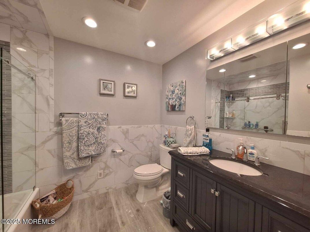 Bathroom, Glass Shower, Interior, Marble Walls, Recessed Lighting, Wood Texture Flooring
