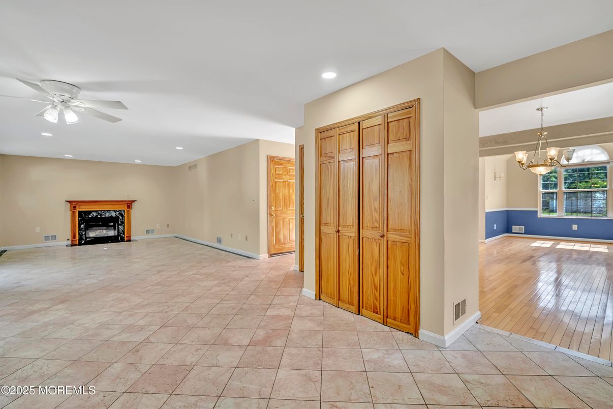 Chandelier, Empty room, Fireplace, Interior, Recessed Lighting, Wood Texture Flooring