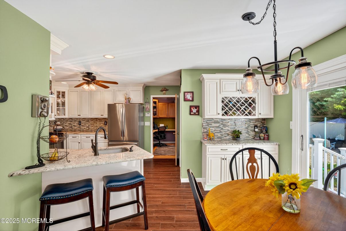 Dining room, Interior, Kitchen, Pendant Lights, Recessed Lighting, Stainless Steel Appliances, Wood Texture Flooring