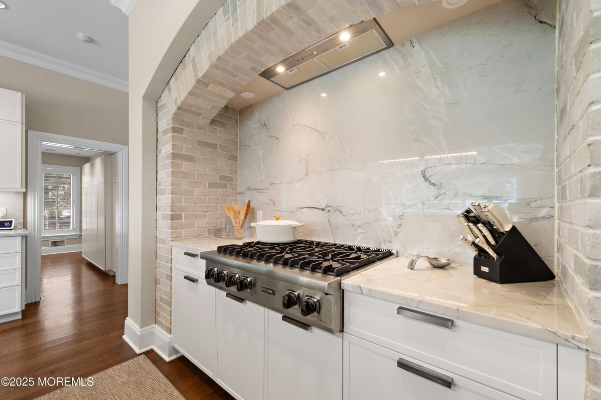Interior, Kitchen, Marble Walls, Recessed Lighting, Stainless Steel Appliances, Wood Texture Flooring
