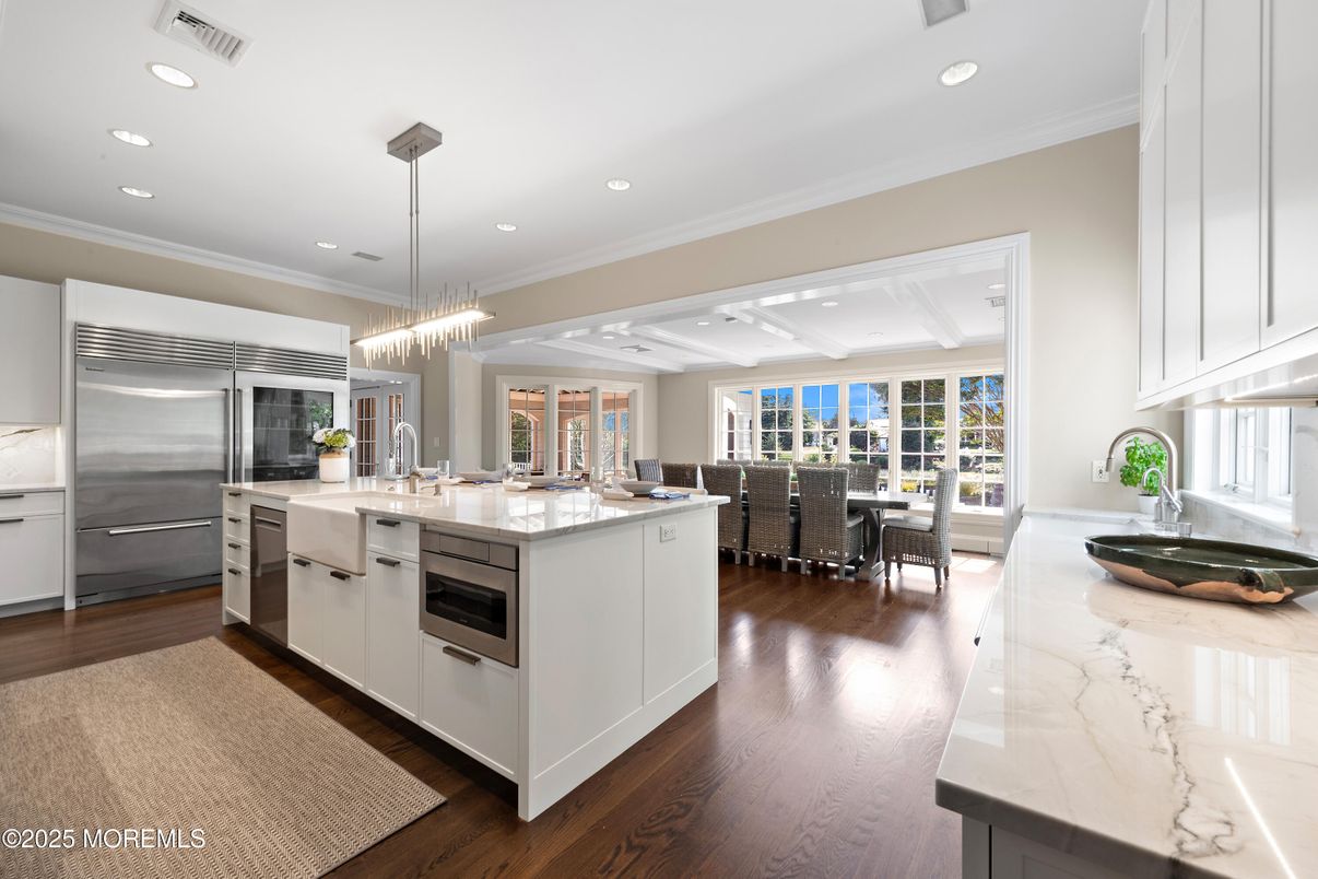 Chandelier, Dining room, Interior, Kitchen, Pendant Lights, Recessed Lighting, Stainless Steel Appliances, Wood Texture Flooring