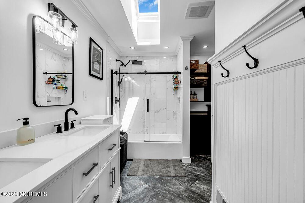 Bathroom, Dual Sink Vanities, Glass Shower, Interior, Marble Walls, Recessed Lighting