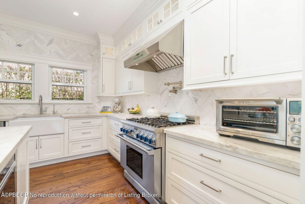 Interior, Kitchen, Marble Walls, Recessed Lighting, Stainless Steel Appliances, Wood Texture Flooring