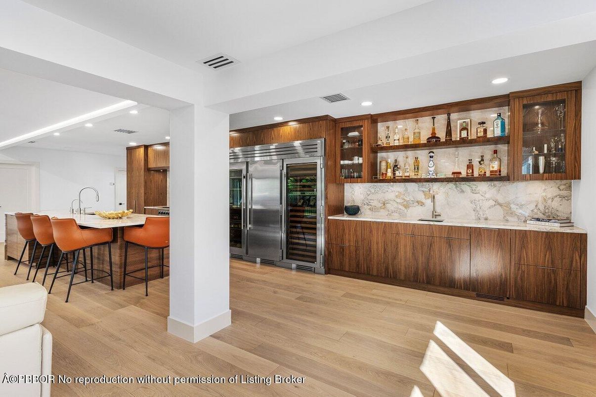 Interior, Kitchen, Marble Walls, Recessed Lighting, Stainless Steel Appliances, Wood Texture Flooring