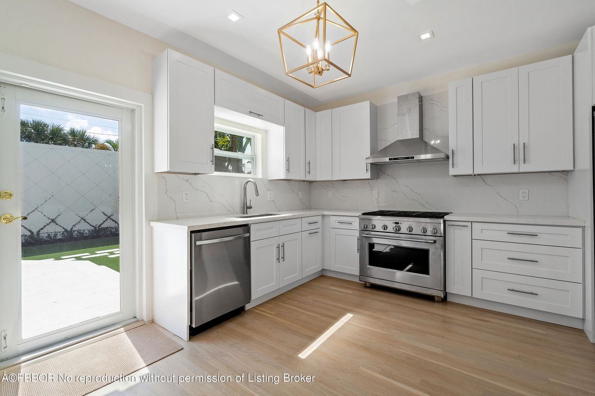 Interior, Kitchen, Marble Walls, Recessed Lighting, Stainless Steel Appliances, Wood Texture Flooring