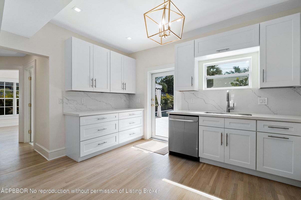 Interior, Kitchen, Marble Walls, Pendant Lights, Recessed Lighting, Stainless Steel Appliances, Wood Texture Flooring
