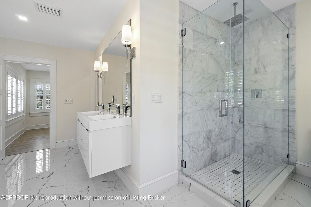 Bathroom, Dual Sink Vanities, Glass Shower, Interior, Marble, Marble Walls, Recessed Lighting