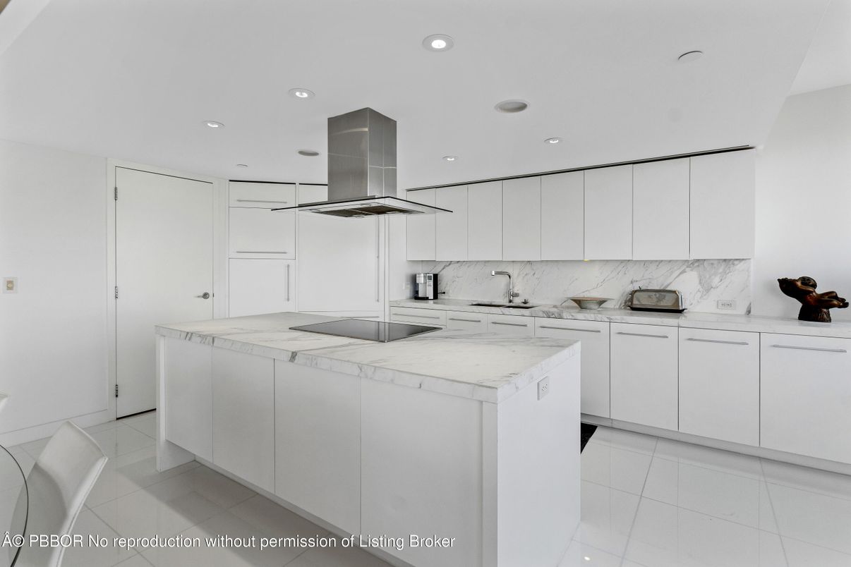 Interior, Kitchen, Marble Walls, Recessed Lighting, Stainless Steel Appliances