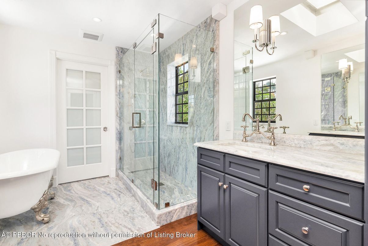 Bathroom, Dual Sink Vanities, Free Standing Baths, Glass Shower, Interior, Marble, Marble Walls, Recessed Lighting, Wood Texture Flooring