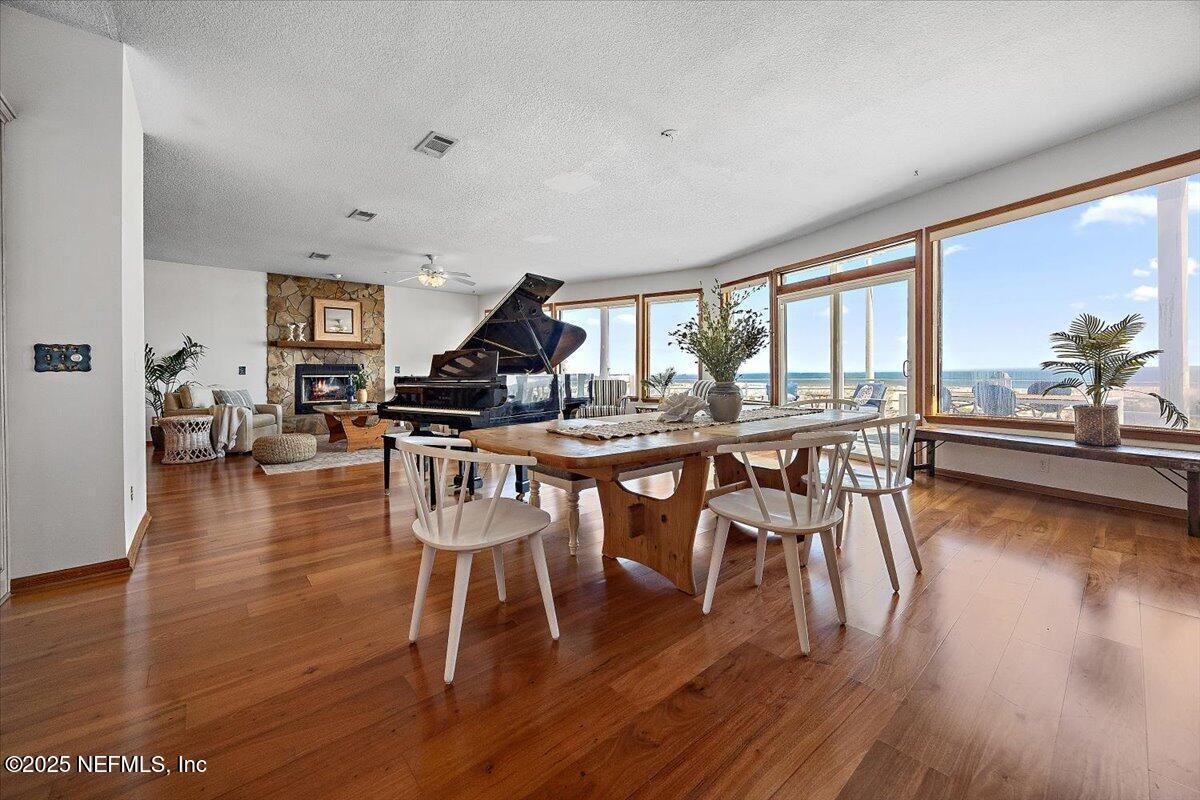 Dining room, Fireplace, Interior, Living room, Piano, Water, Wood Texture Flooring