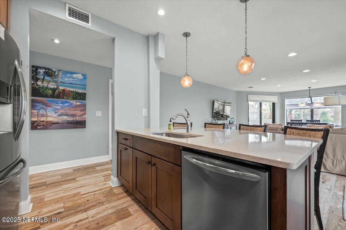 Dining room, Interior, Kitchen, Pendant Lights, Recessed Lighting, Stainless Steel Appliances, Wood Texture Flooring