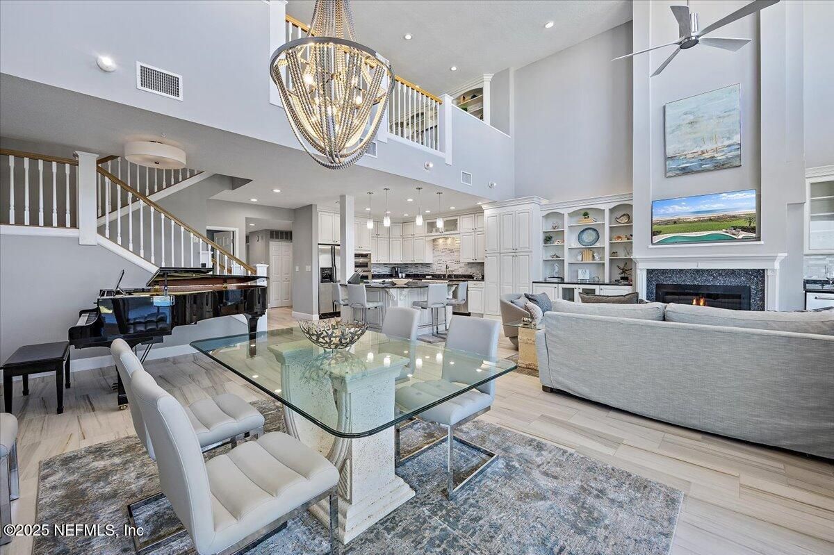 Chandelier, Dining room, Fireplace, Interior, Kitchen, Living room, Pendant Lights, Piano, Recessed Lighting, Wood Texture Flooring