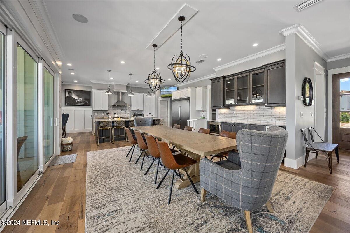 Chandelier, Dining room, Interior, Kitchen, Pendant Lights, Recessed Lighting, Stainless Steel Appliances, Wood Texture Flooring