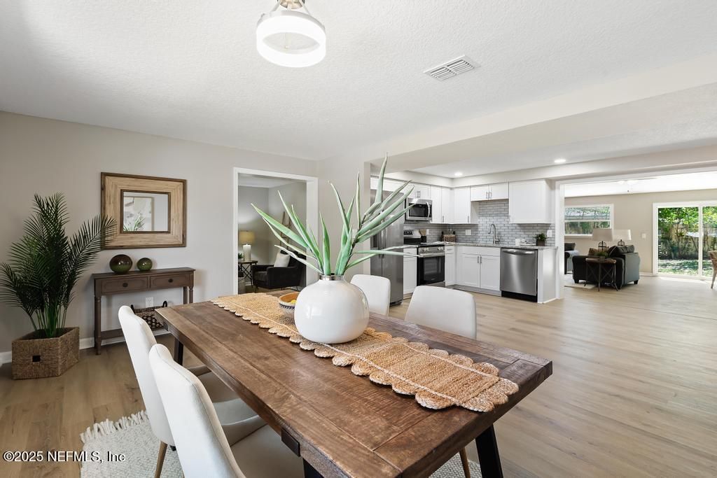 Dining room, Interior, Kitchen, Recessed Lighting, Stainless Steel Appliances, Wood Texture Flooring