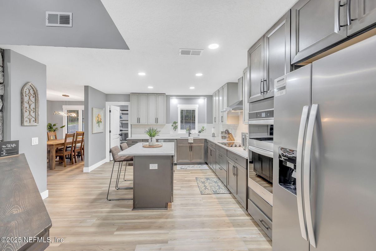 Dining room, Interior, Kitchen, Recessed Lighting, Stainless Steel Appliances, Wood Texture Flooring