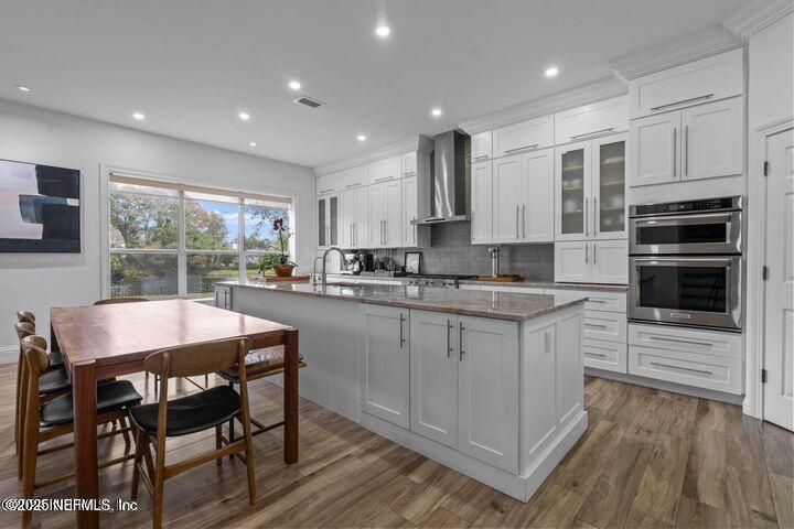 Dining room, Interior, Kitchen, Recessed Lighting, Stainless Steel Appliances, Wood Texture Flooring