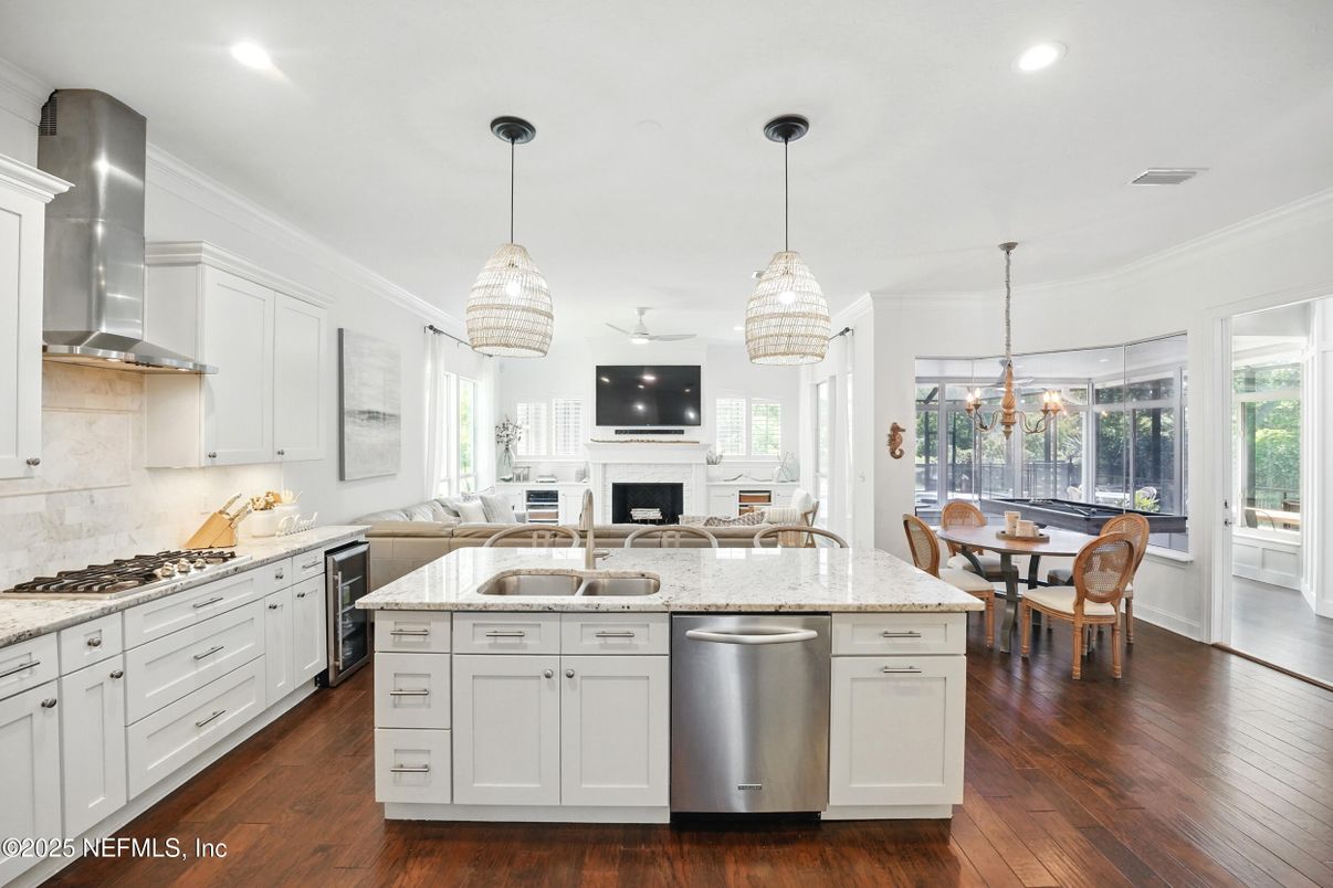Dining room, Fireplace, Interior, Kitchen, Pendant Lights, Recessed Lighting, Stainless Steel Appliances, Wood Texture Flooring