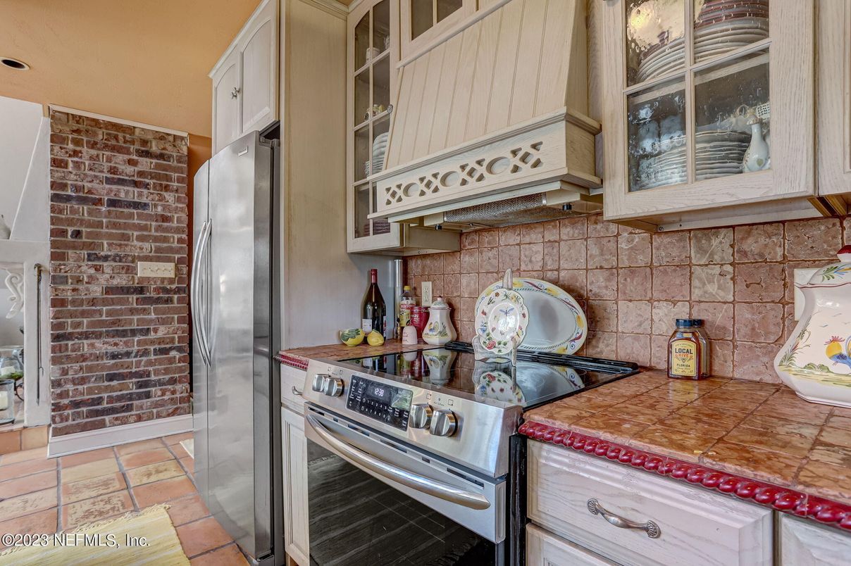 Interior, Kitchen, Stainless Steel Appliances, Stone Walls, Tile Countertops