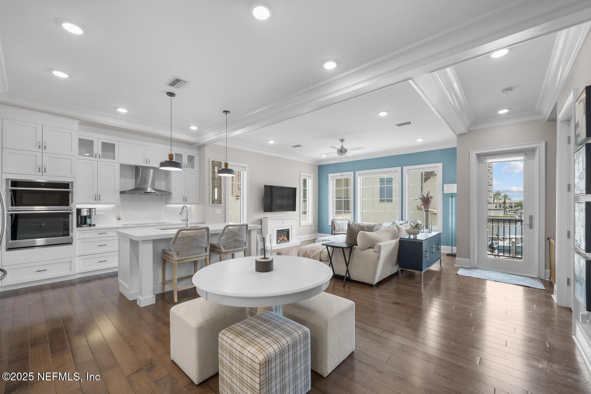 Fireplace, Interior, Kitchen, Living room, Pendant Lights, Recessed Lighting, Stainless Steel Appliances, Wood Texture Flooring