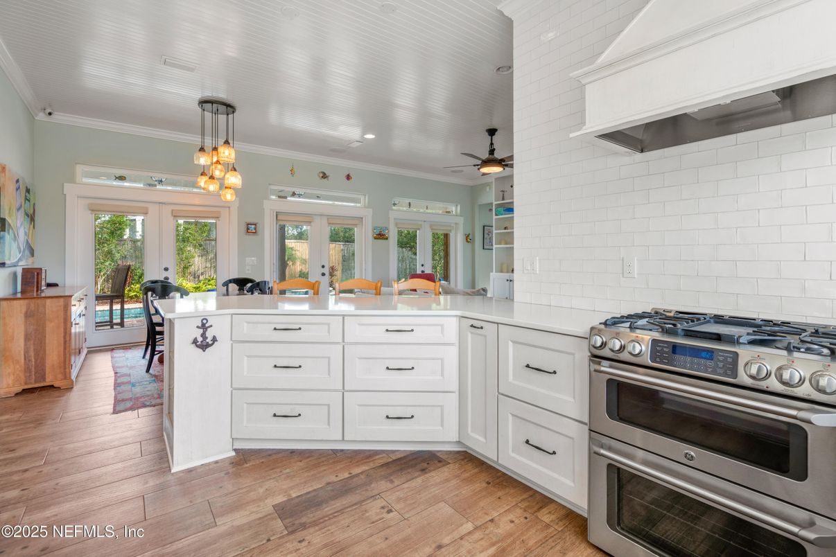 Interior, Kitchen, Pendant Lights, Recessed Lighting, Stainless Steel Appliances, Stone Walls, Wood Texture Flooring