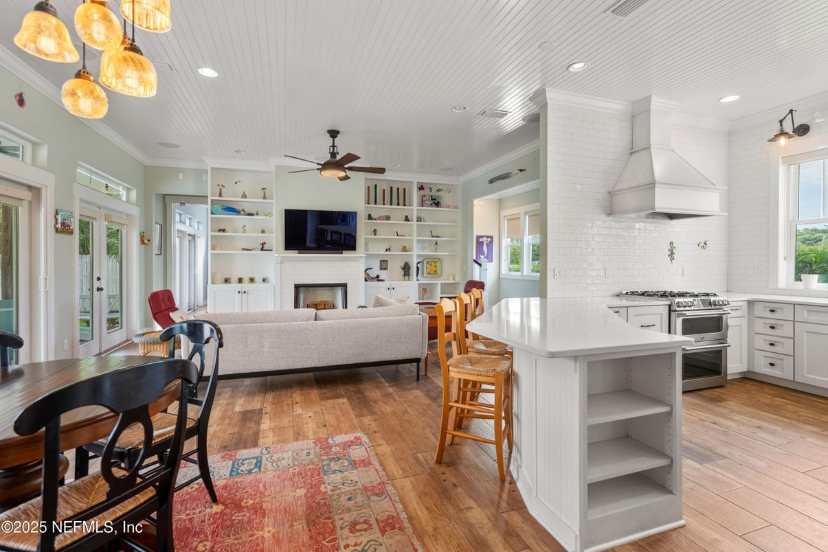 Dining room, Fireplace, Interior, Kitchen, Living room, Pendant Lights, Recessed Lighting, Stainless Steel Appliances, Wood Texture Flooring