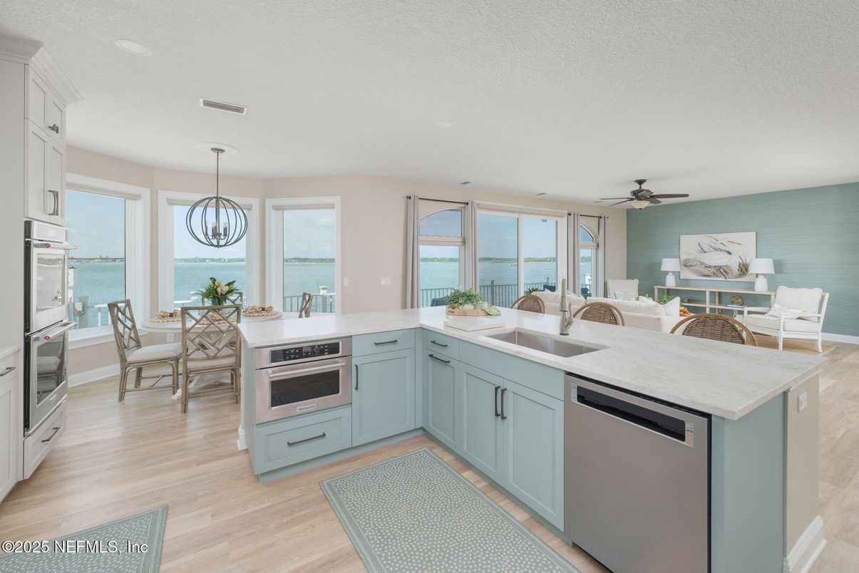 Dining room, Interior, Kitchen, Pendant Lights, Recessed Lighting, Stainless Steel Appliances, Water, Wood Texture Flooring