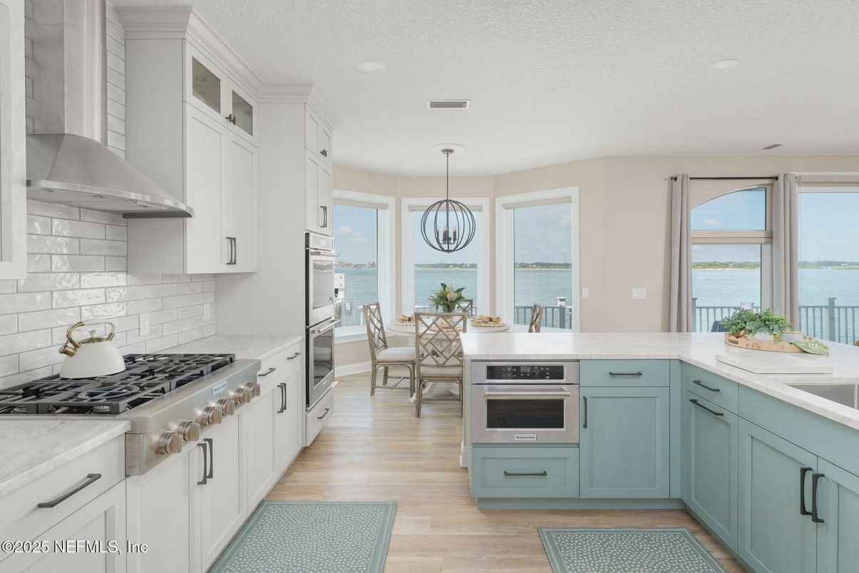 Chandelier, Dining room, Interior, Kitchen, Pendant Lights, Recessed Lighting, Stainless Steel Appliances, Water, Wood Texture Flooring