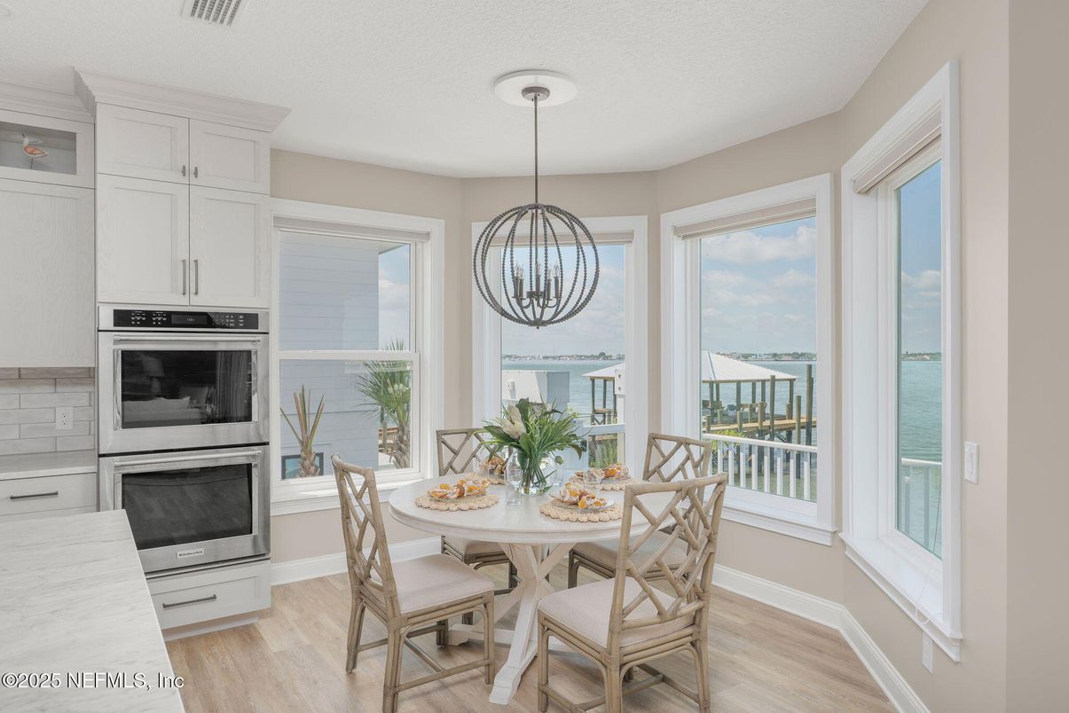 Dining room, Interior, Kitchen, Pendant Lights, Stainless Steel Appliances, Water, Wood Texture Flooring
