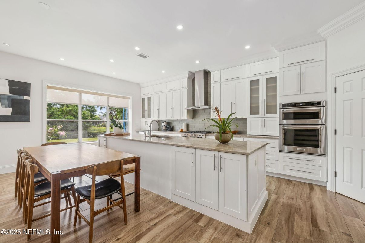 Dining room, Interior, Kitchen, Recessed Lighting, Stainless Steel Appliances, Wood Texture Flooring