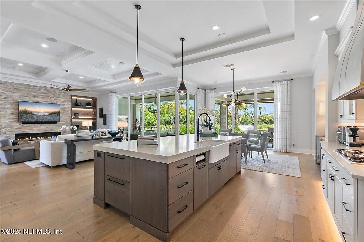 Dining room, Fireplace, Interior, Kitchen, Living room, Pendant Lights, Recessed Lighting, Stainless Steel Appliances, Stone Walls, Wood Texture Flooring