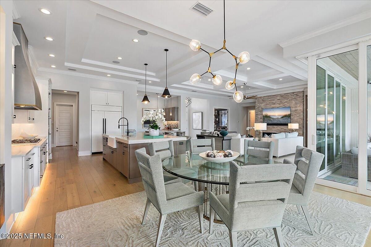 Dining room, Interior, Kitchen, Living room, Pendant Lights, Recessed Lighting, Stainless Steel Appliances, Stone Walls, Wood Texture Flooring