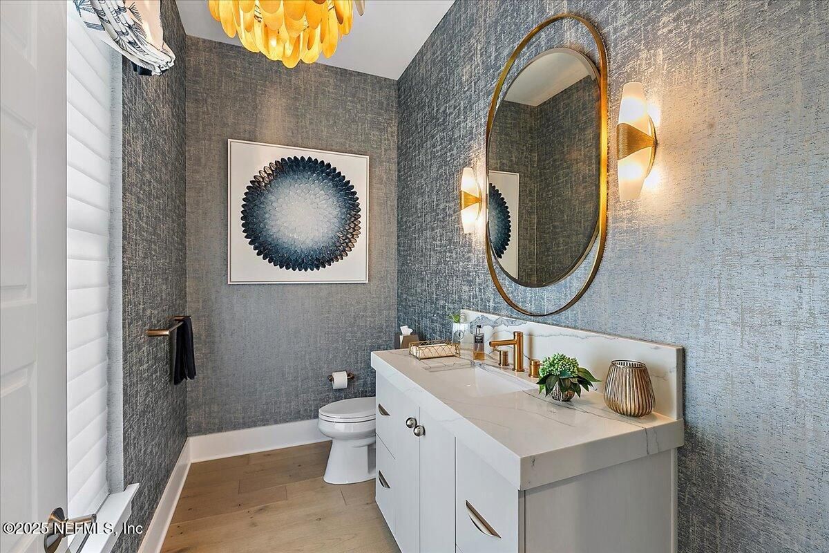 Bathroom, Chandelier, Dual Sink Vanities, Interior, Wood Texture Flooring