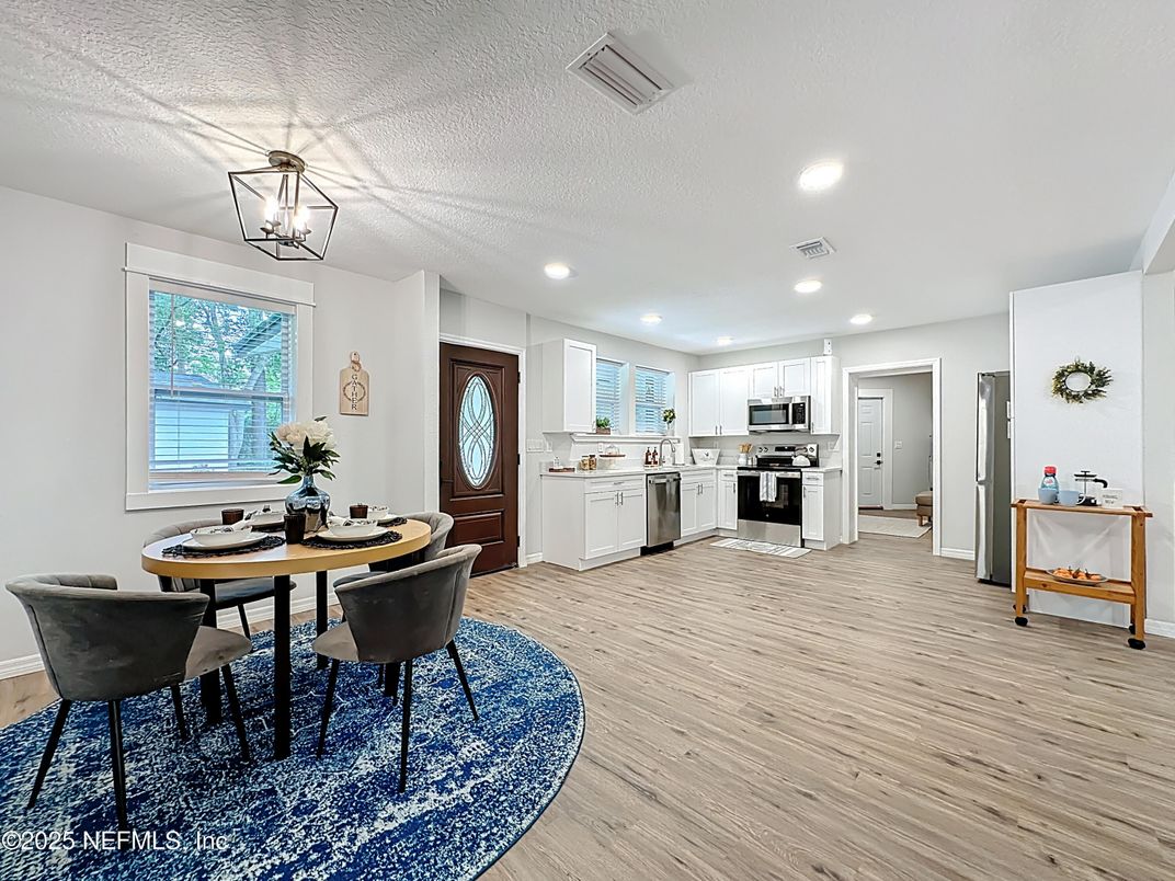 Dining room, Interior, Kitchen, Pendant Lights, Recessed Lighting, Stainless Steel Appliances, Wood Texture Flooring