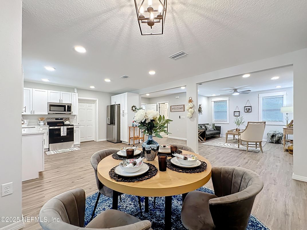 Dining room, Interior, Kitchen, Living room, Recessed Lighting, Stainless Steel Appliances, Wood Texture Flooring