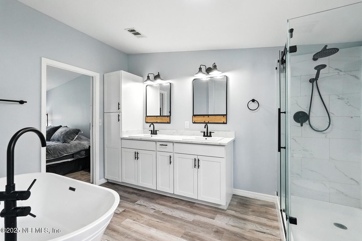 Bathroom, Bedroom, Dual Sink Vanities, Free Standing Baths, Glass Shower, Interior, Marble Walls, Wood Texture Flooring