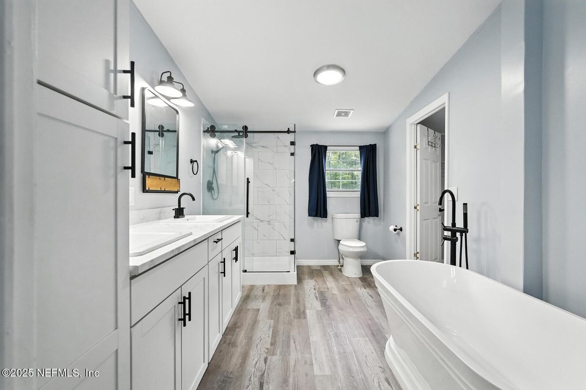 Bathroom, Dual Sink Vanities, Free Standing Baths, Glass Shower, Interior, Marble Walls, Wood Texture Flooring