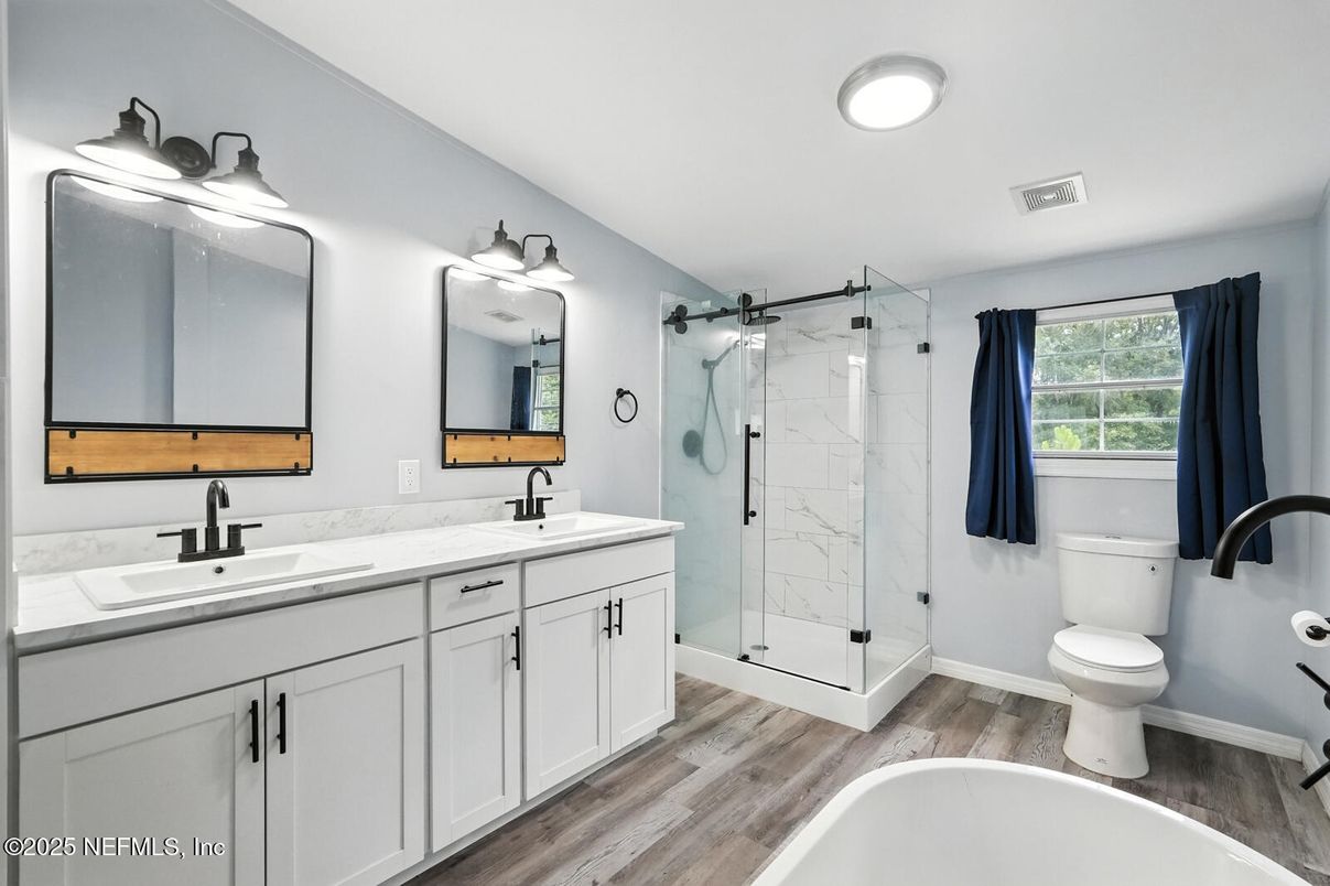 Bathroom, Dual Sink Vanities, Glass Shower, Interior, Marble Walls, Wood Texture Flooring