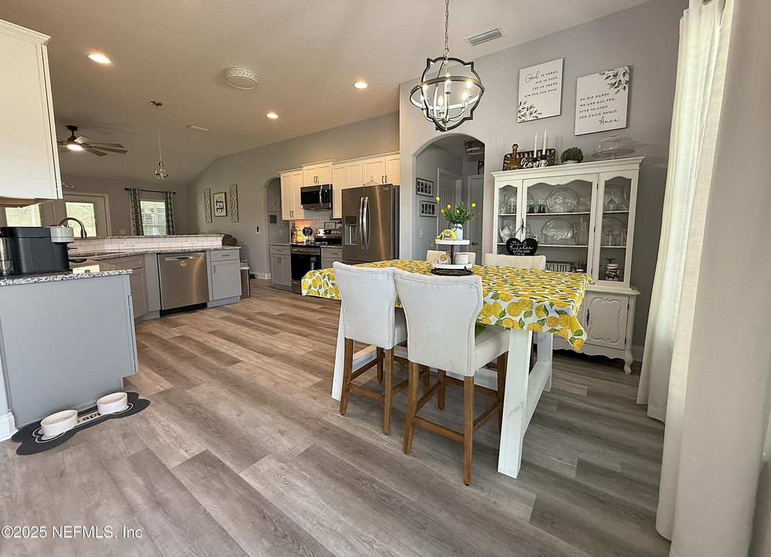 Dining room, Interior, Kitchen, Pendant Lights, Recessed Lighting, Stainless Steel Appliances, Wood Texture Flooring