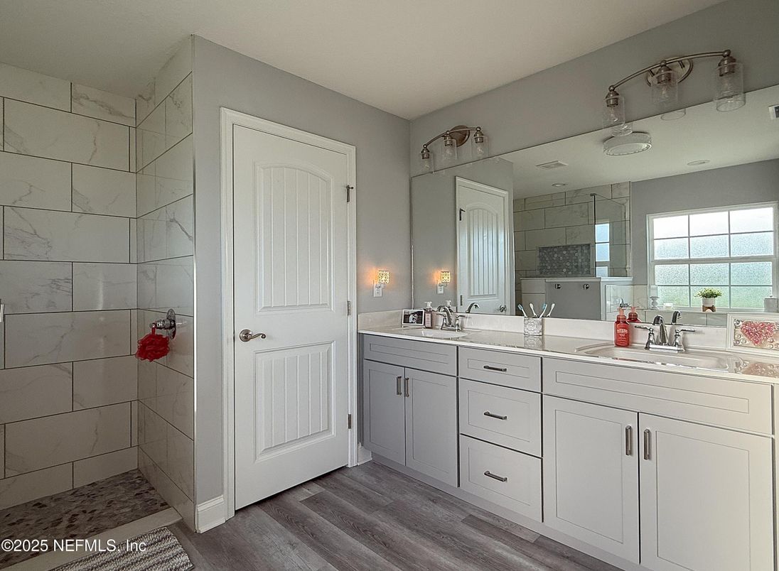 Bathroom, Dual Sink Vanities, Interior, Marble Walls, Wood Texture Flooring