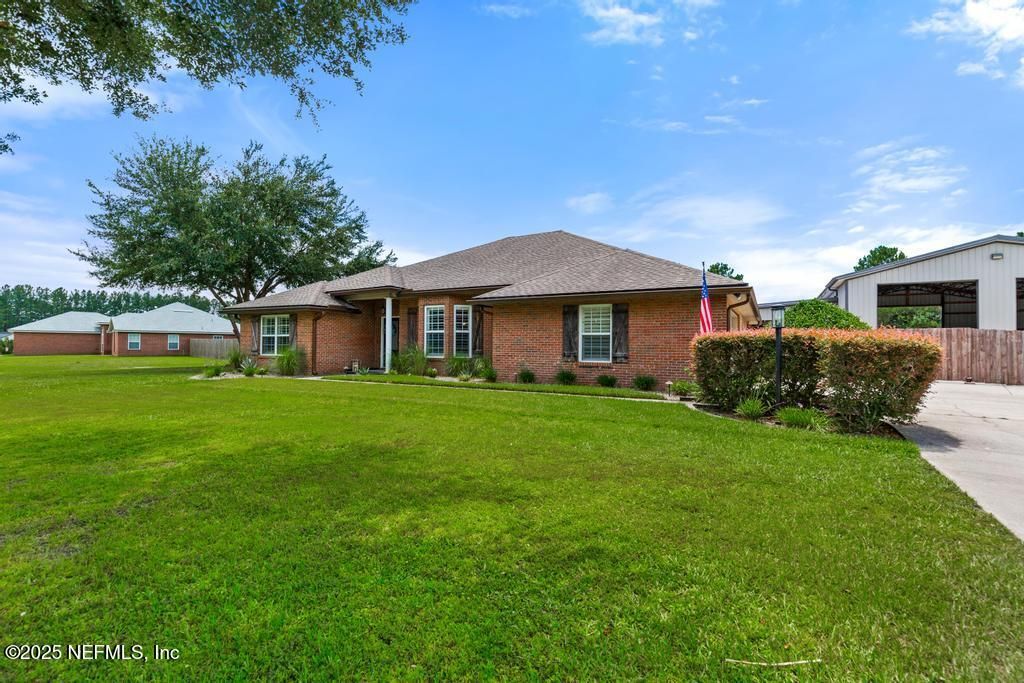 Attached, Backyard, Exterior, Facade, Brick Facade, Ranch