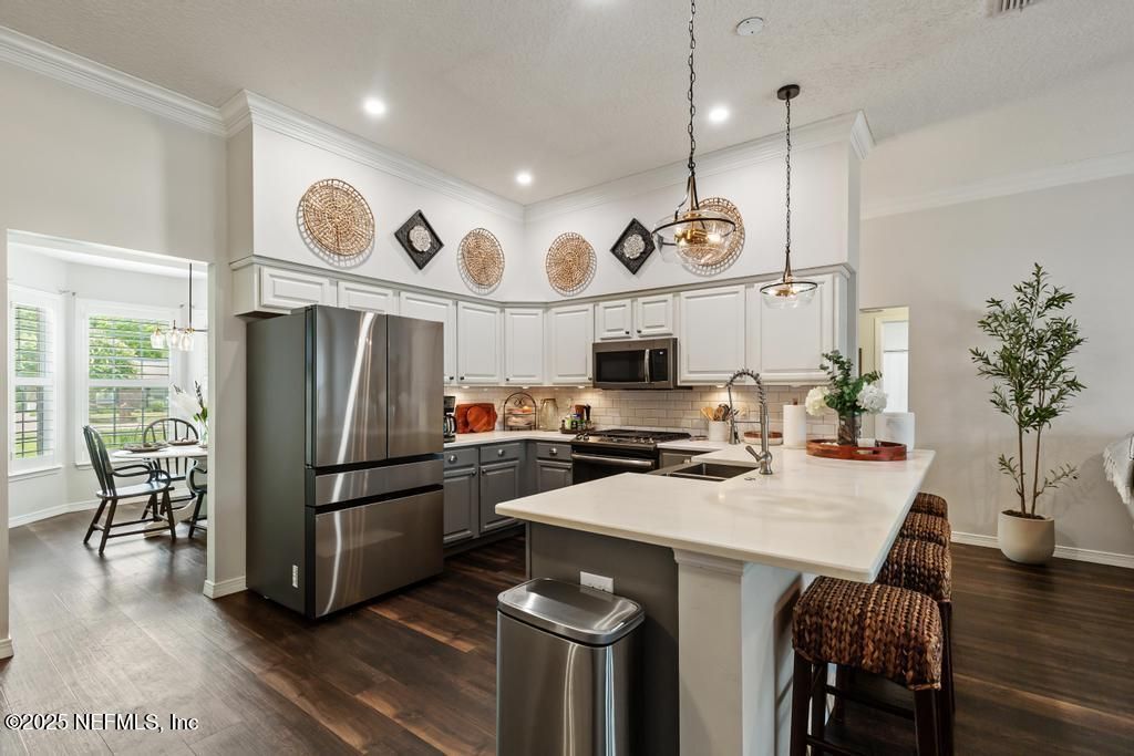Dining room, Interior, Kitchen, Pendant Lights, Recessed Lighting, Stainless Steel Appliances, Wood Texture Flooring