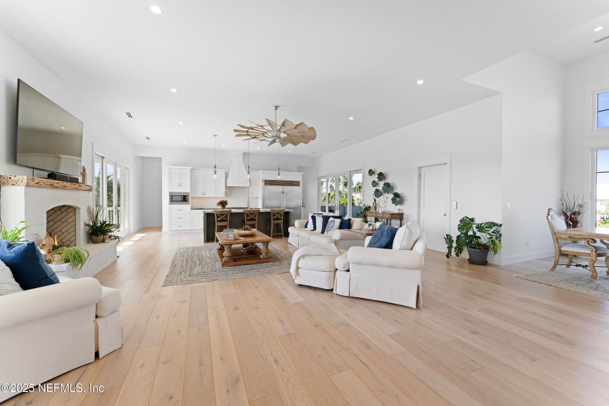 Dining room, Fireplace, Interior, Kitchen, Living room, Pendant Lights, Recessed Lighting, Stainless Steel Appliances, Wood Texture Flooring