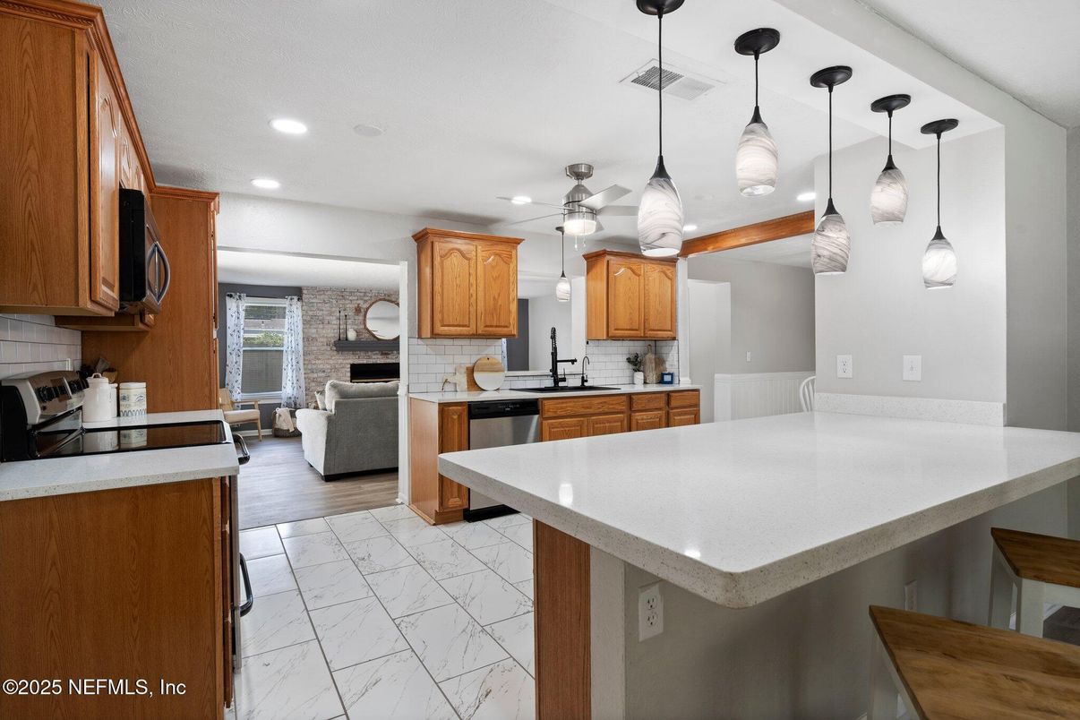 Fireplace, Interior, Kitchen, Living room, Marble, Pendant Lights, Recessed Lighting, Stone Walls, Wood Texture Flooring