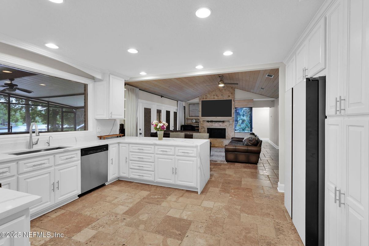 Fireplace, Interior, Kitchen, Recessed Lighting, Stainless Steel Appliances, Stone Walls, Wooden Ceilings